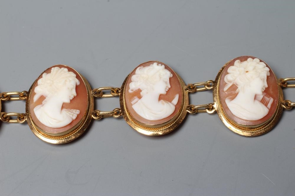 A SHELL CAMEO BRACELET, the eight oval panels carved with the head portrait of a young lady, in Image
