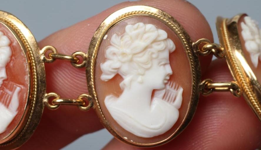 A SHELL CAMEO BRACELET, the eight oval panels carved with the head portrait of a young lady, in Image