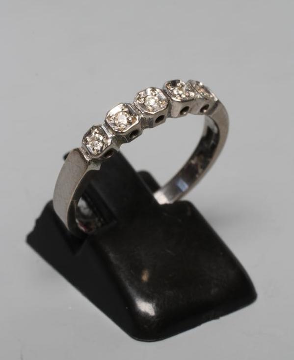 A FIVE STONE DIAMOND HALF HOOP RING, the small round brilliants illusion set in square mounts to a Image