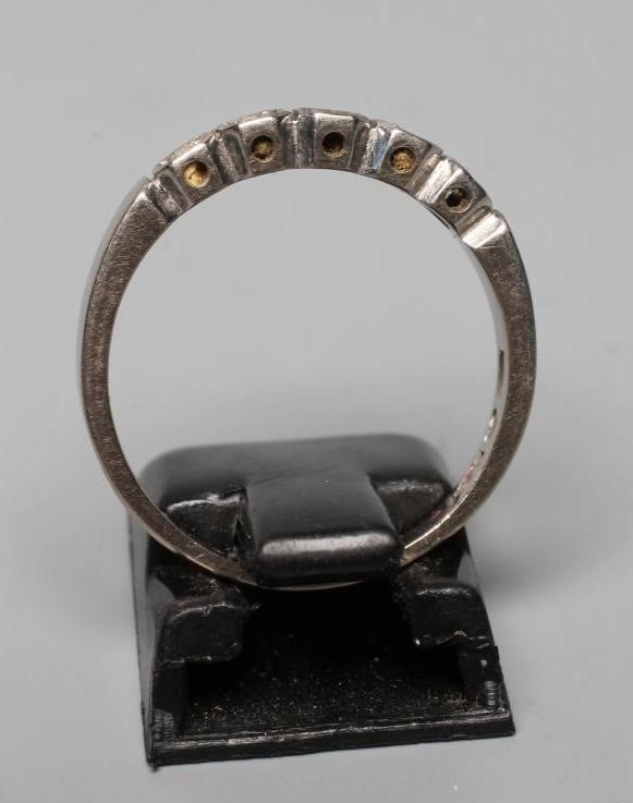 A FIVE STONE DIAMOND HALF HOOP RING, the small round brilliants illusion set in square mounts to a Image