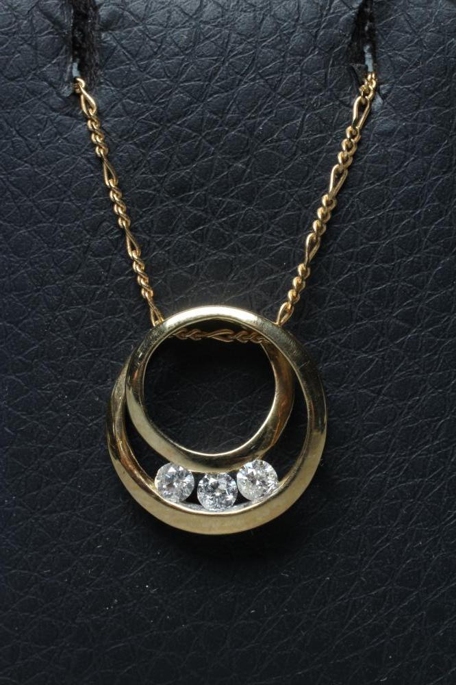 A DIAMOND PENDANT, the open circular scroll channel set with three round brilliants, threaded Image