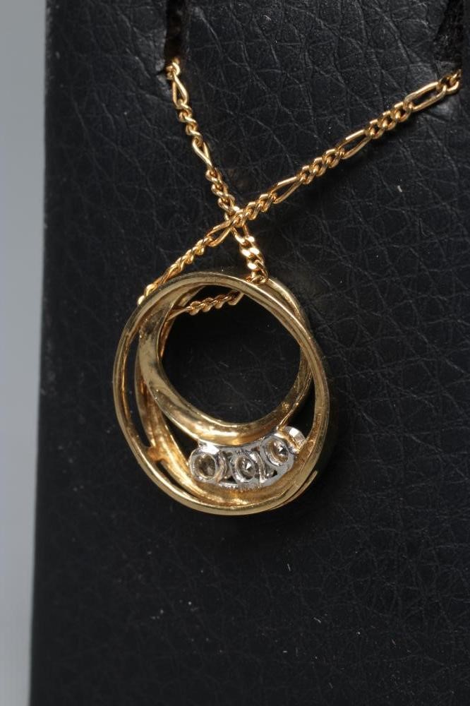 A DIAMOND PENDANT, the open circular scroll channel set with three round brilliants, threaded Image