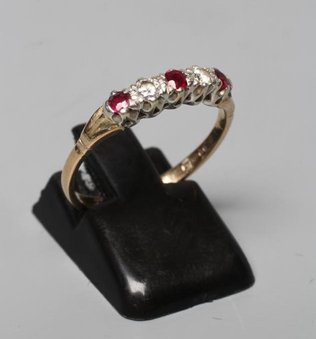 A RUBY AND DIAMOND RING, the three facet cut rubies and two round brilliant cut diamonds point set Image