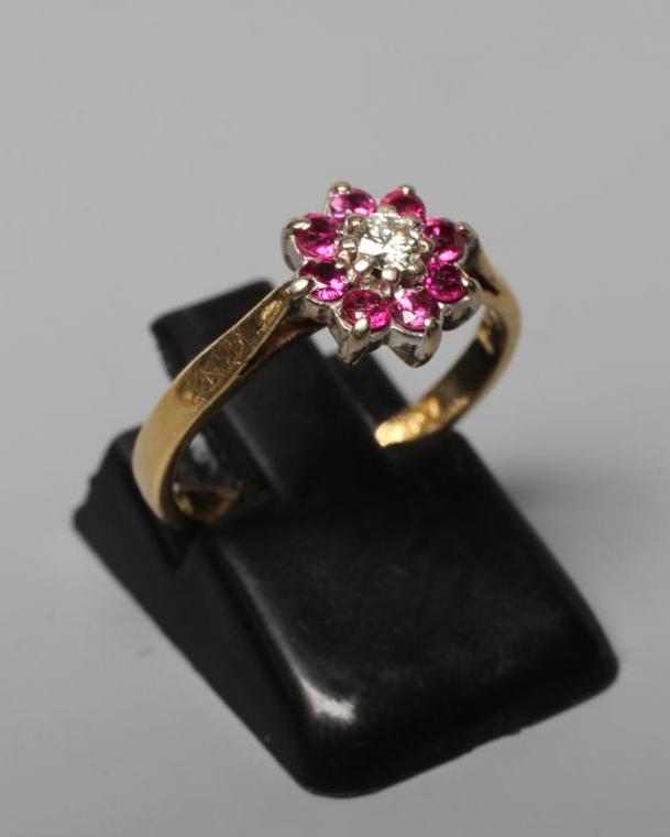 A RUBY AND DIAMOND CLUSTER RING Image
