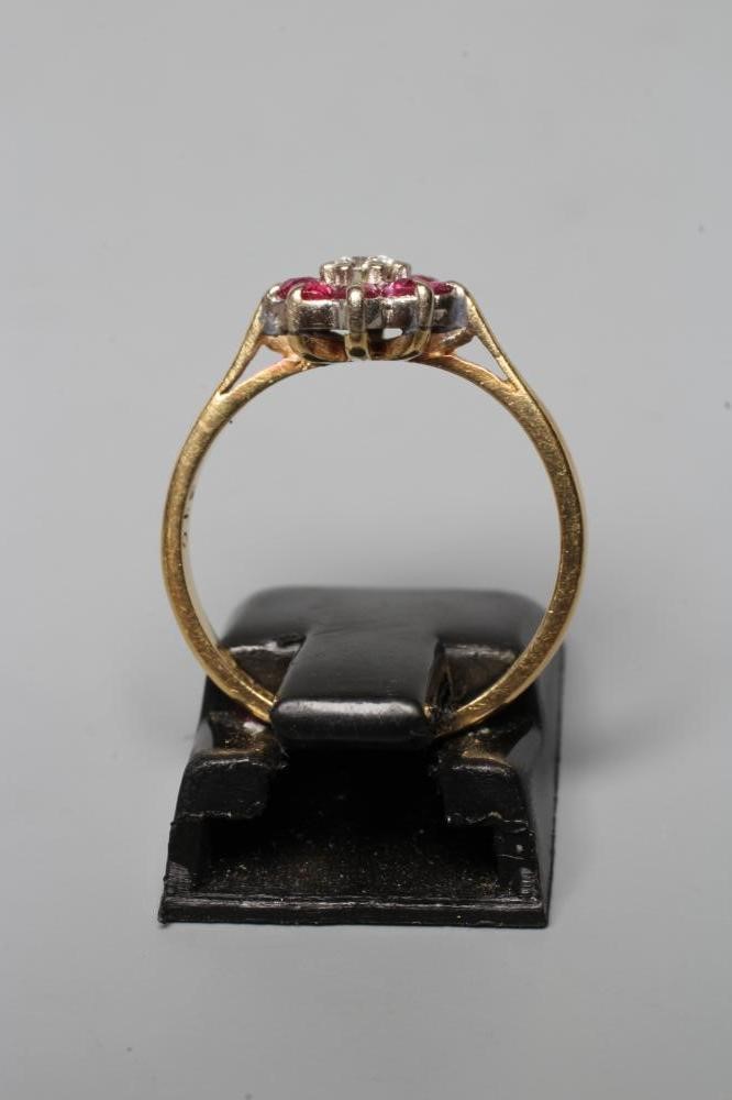 A RUBY AND DIAMOND CLUSTER RING Image