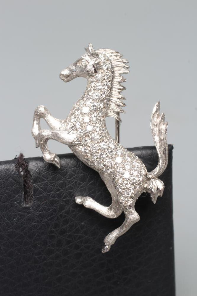 A DIAMOND HORSE BROOCH, modelled galloping, point set with numerous small brilliant cut stones to an Image