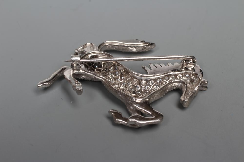A DIAMOND HORSE BROOCH, modelled galloping, point set with numerous small brilliant cut stones to an Image