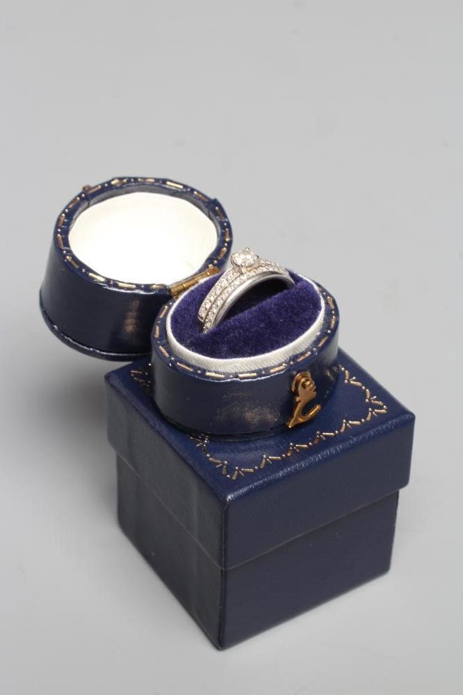 A DIAMOND ENGAGEMENT RING WITH MATCHING WEDDING RING Image