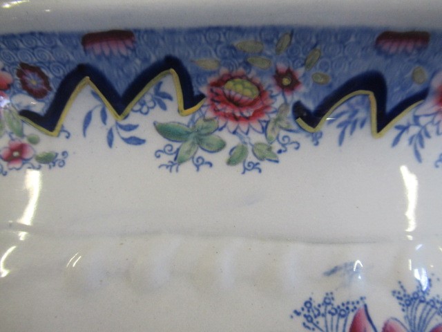 A VICTORIAN EARTHENWARE FOOTBATH of lobed bombe rounded oblong form with two scroll handles Image