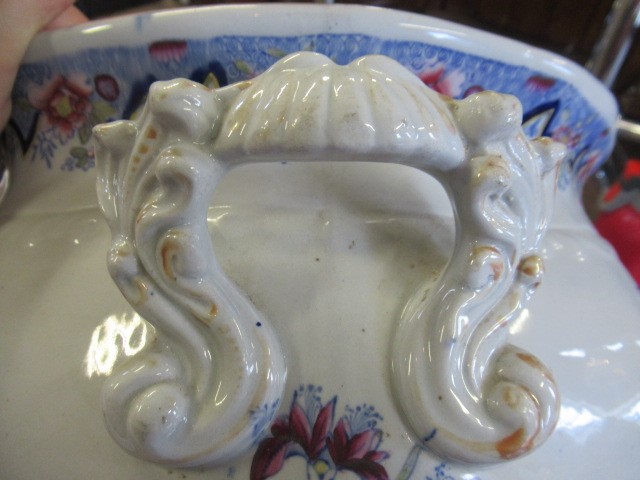 A VICTORIAN EARTHENWARE FOOTBATH of lobed bombe rounded oblong form with two scroll handles Image