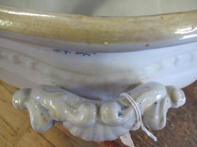 A VICTORIAN EARTHENWARE FOOTBATH of lobed bombe rounded oblong form with two scroll handles Image