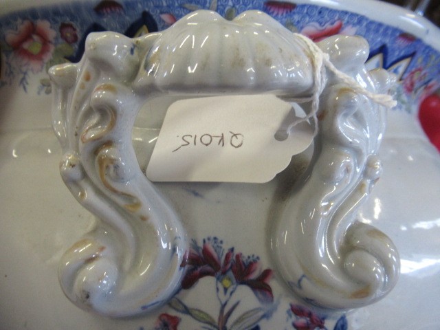 A VICTORIAN EARTHENWARE FOOTBATH of lobed bombe rounded oblong form with two scroll handles Image
