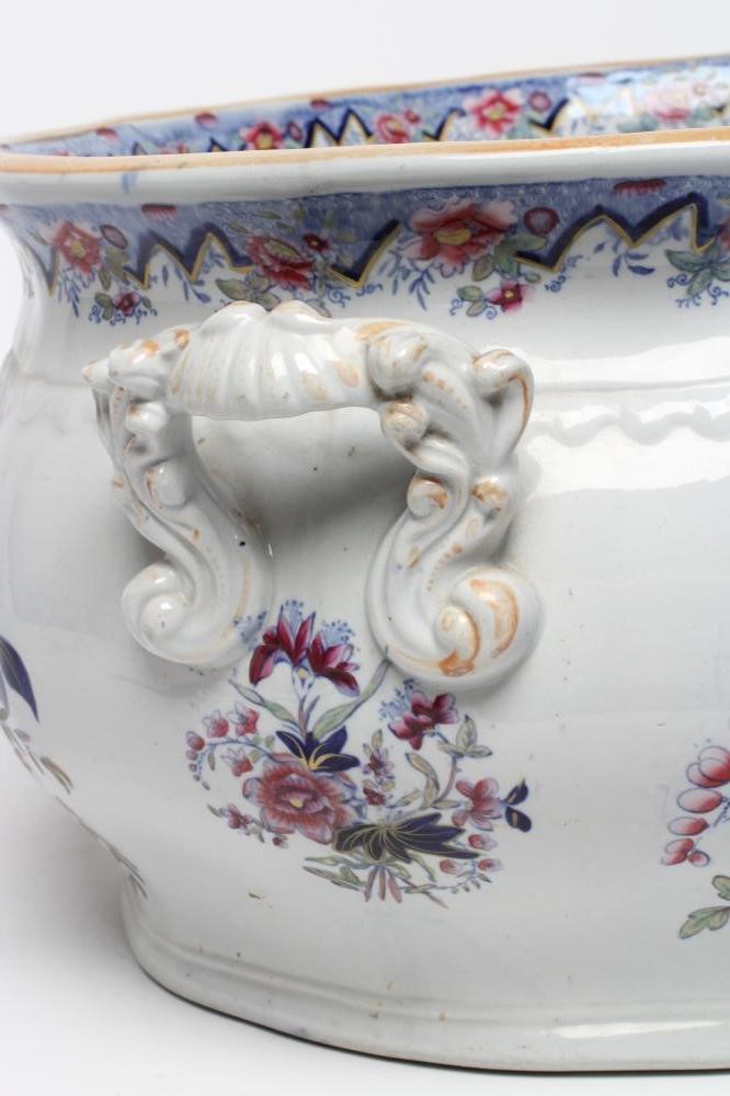 A VICTORIAN EARTHENWARE FOOTBATH of lobed bombe rounded oblong form with two scroll handles Image