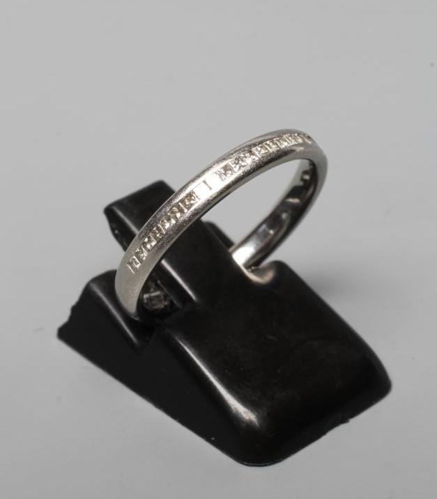 A DIAMOND HALF HOOP ETERNITY RING, the twenty seven Princess cut stones centrally channel set to a Image