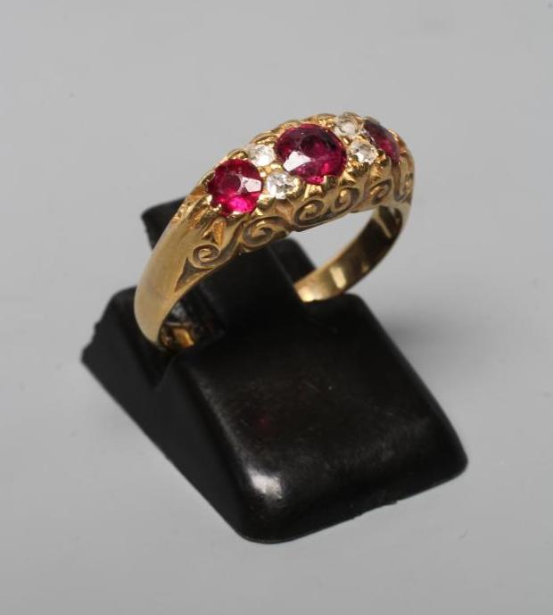 A GARNET AND DIAMOND RING Image