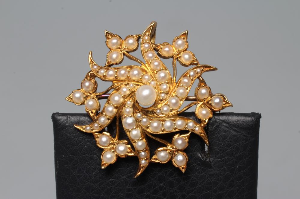 A LATE VICTORIAN WHORL BROOCH, the six whorls with trefoils between and set with graduating seed Image