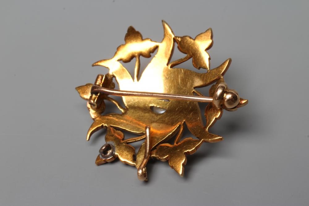 A LATE VICTORIAN WHORL BROOCH, the six whorls with trefoils between and set with graduating seed Image