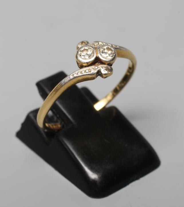 A TWO STONE DIAMOND CROSSOVER RING Image