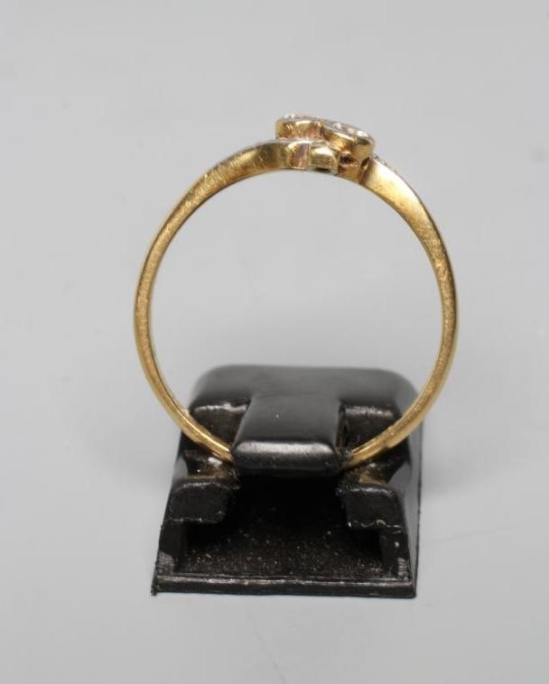 A TWO STONE DIAMOND CROSSOVER RING Image