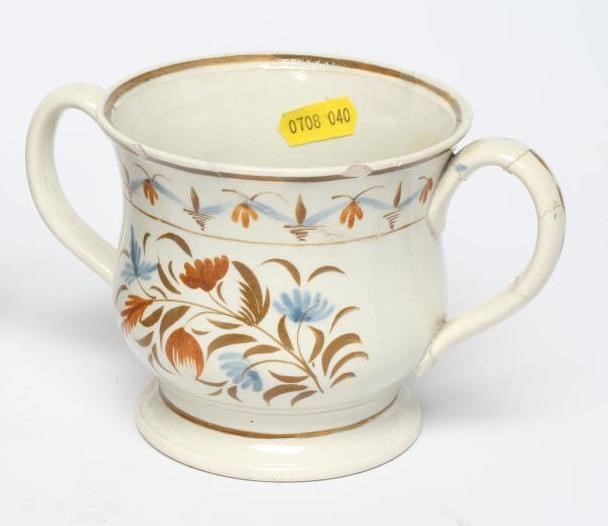 A COLLECTION OF ENGLISH PEARLWARE comprising a cylindrical mug with engine turned rim Image