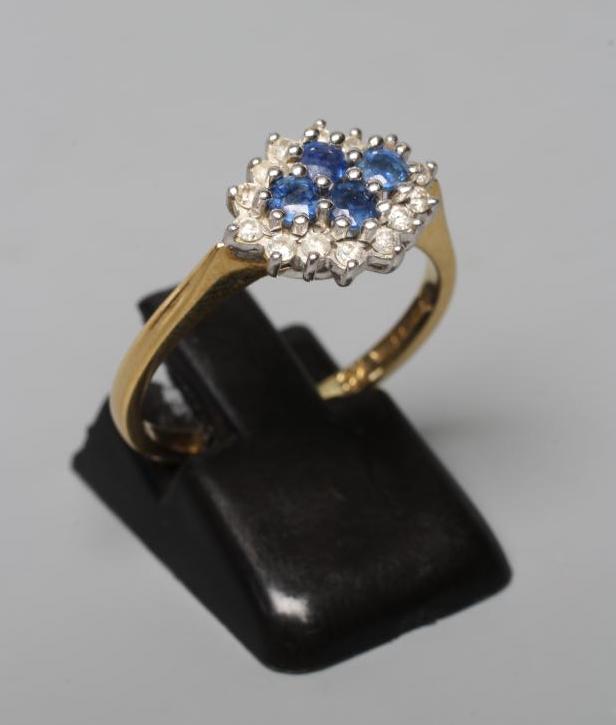 A SAPPHIRE AND DIAMOND CLUSTER RING Image