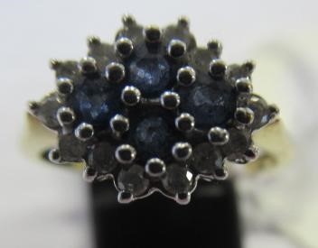 A SAPPHIRE AND DIAMOND CLUSTER RING Image