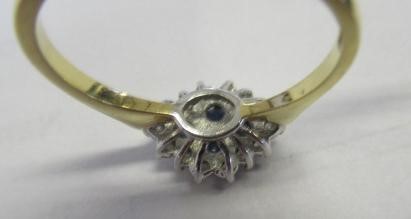 A SAPPHIRE AND DIAMOND CLUSTER RING Image