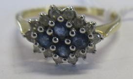 A SAPPHIRE AND DIAMOND CLUSTER RING Image