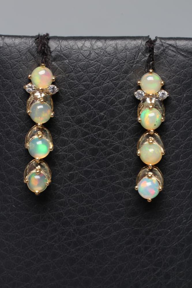 A PAIR OF OPAL DROP EAR STUDS Image