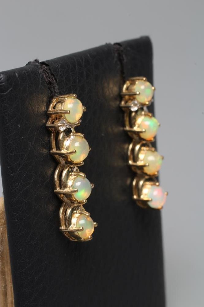 A PAIR OF OPAL DROP EAR STUDS Image