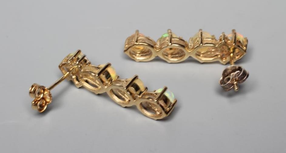 A PAIR OF OPAL DROP EAR STUDS Image