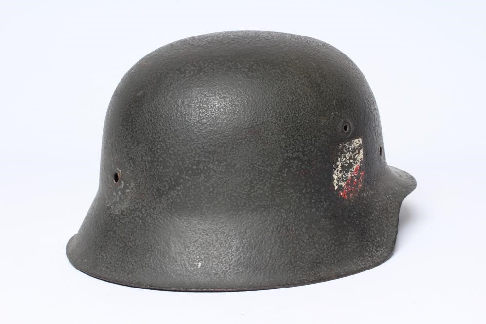 A GERMAN THIRD REICH HELMET of typical form with remnants of side transfers, 11 3/8" front to back Image