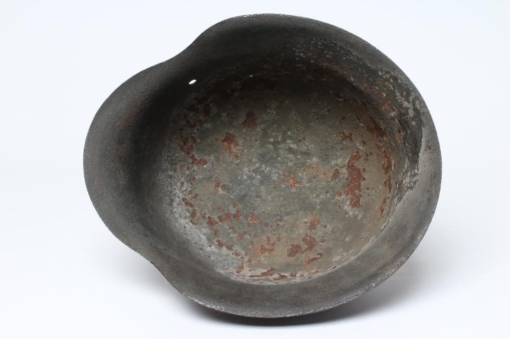 A GERMAN THIRD REICH HELMET of typical form with remnants of side transfers, 11 3/8" front to back Image