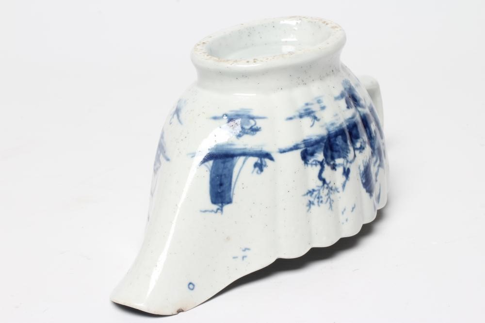 A WORCESTER PORCELAIN FRINGED TREE PATTERN SAUCEBOAT, c.1758, of fluted oval form and painted in Image