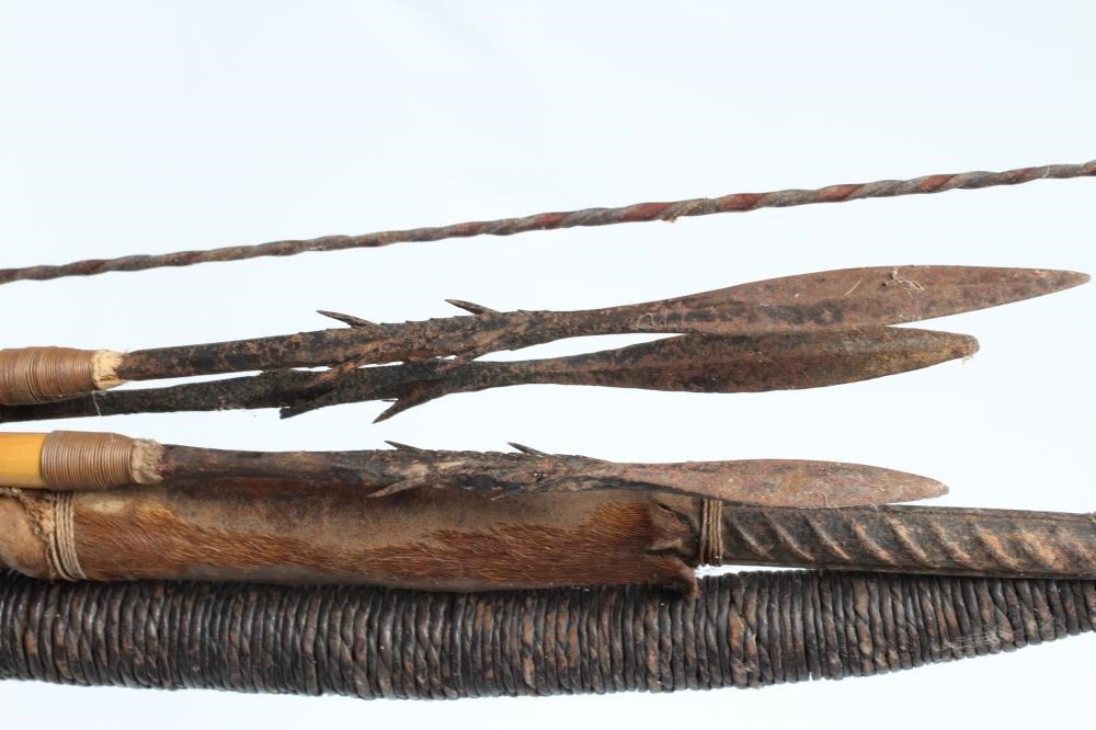 EAST AFRICAN WEAPONS, comprising a 59" long wooden bow with gut wrappings and string, three bamboo Image