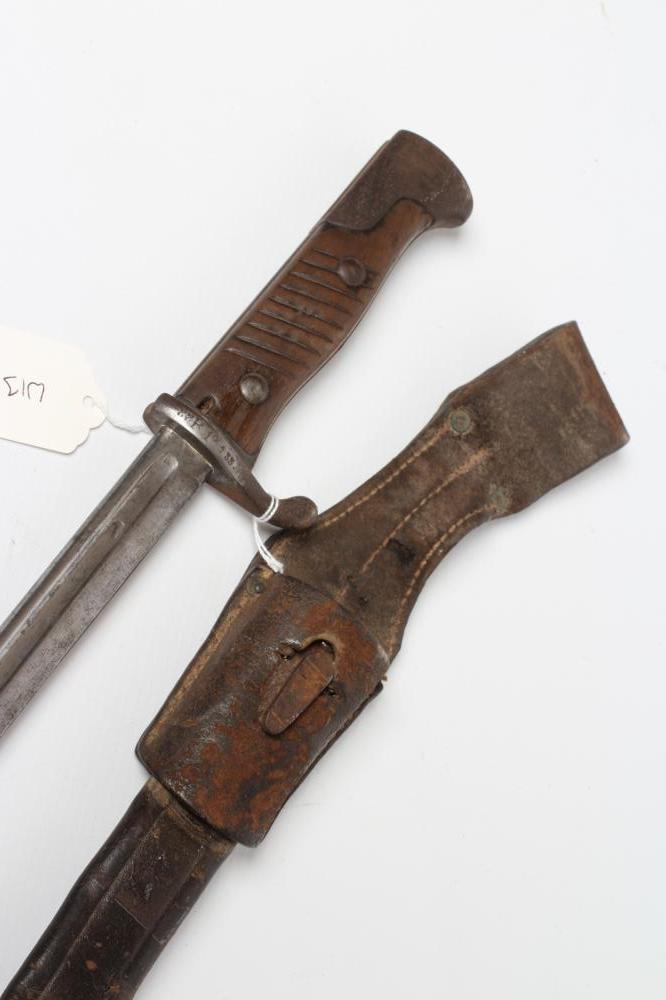 A GERMAN M1889 BAYONET with 20 1/4" pipe back blade, maker's mark for G.G. Haenel, hilt inscribed Image