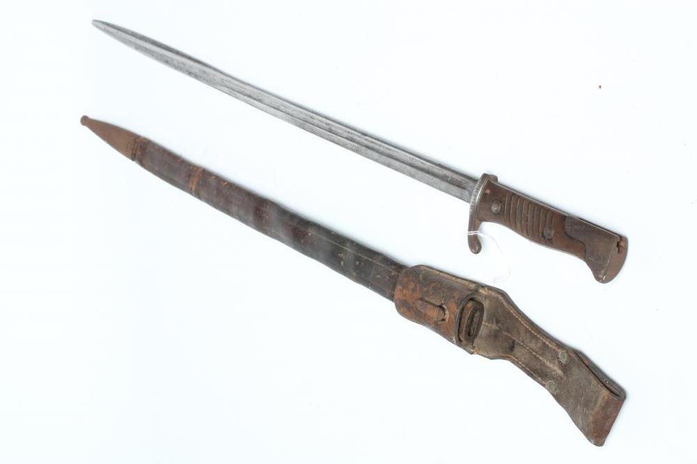 A GERMAN M1889 BAYONET with 20 1/4" pipe back blade, maker's mark for G.G. Haenel, hilt inscribed Image