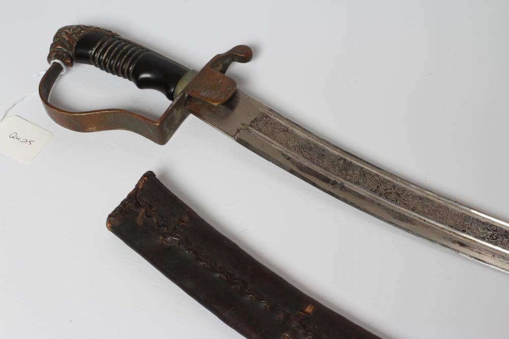 A CAVALRY OFFICER'S SABRE, the 30 1/4" curved blade etched with script within foliate scrolls, brass Image