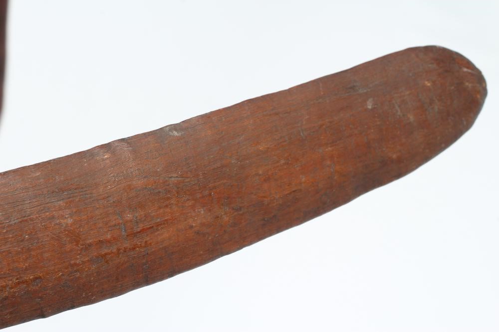 ABORIGINAL TOOLS AND WEAPONS, c.1900, comprising three Boomerangs with linear carved patination, Image