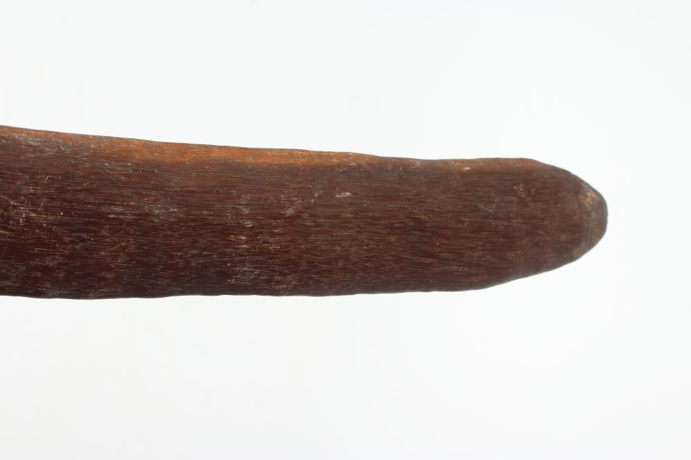 ABORIGINAL TOOLS AND WEAPONS, c.1900, comprising three Boomerangs with linear carved patination, Image