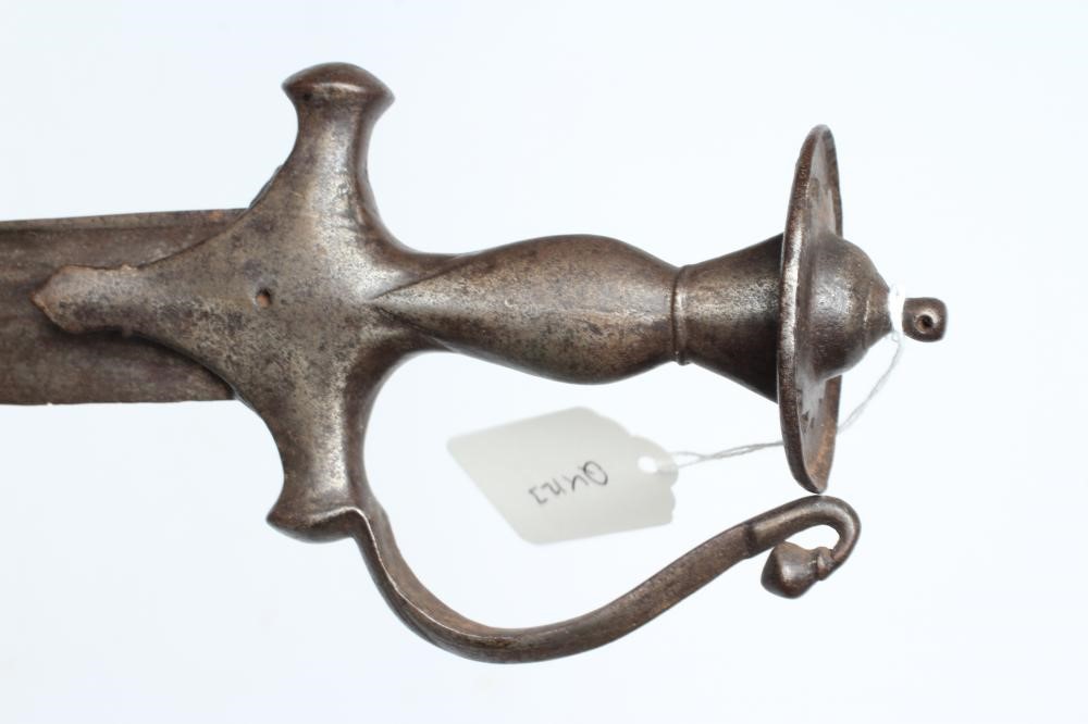 AN INDIAN TALWAR, 19th century, with 34 1/4" curved and twin fullered blade, the steel hilt of Image