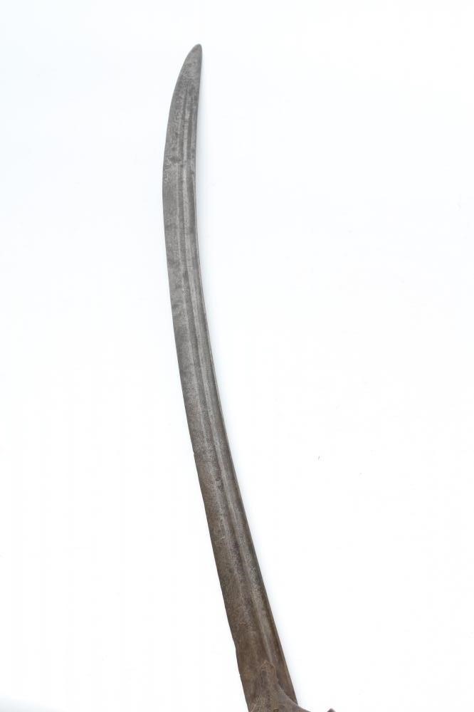 AN INDIAN TALWAR, 19th century, with 34 1/4" curved and twin fullered blade, the steel hilt of Image