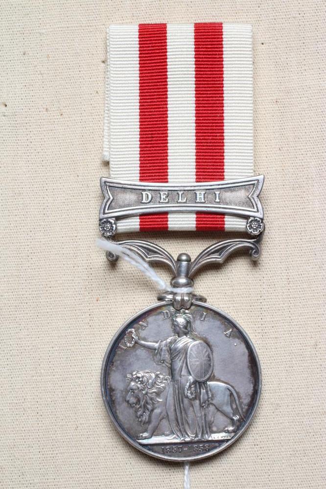 AN INDIAN MUTINY MEDAL with Delhi clasp, awarded to Robert Barrie of the 2nd European Bengal Image
