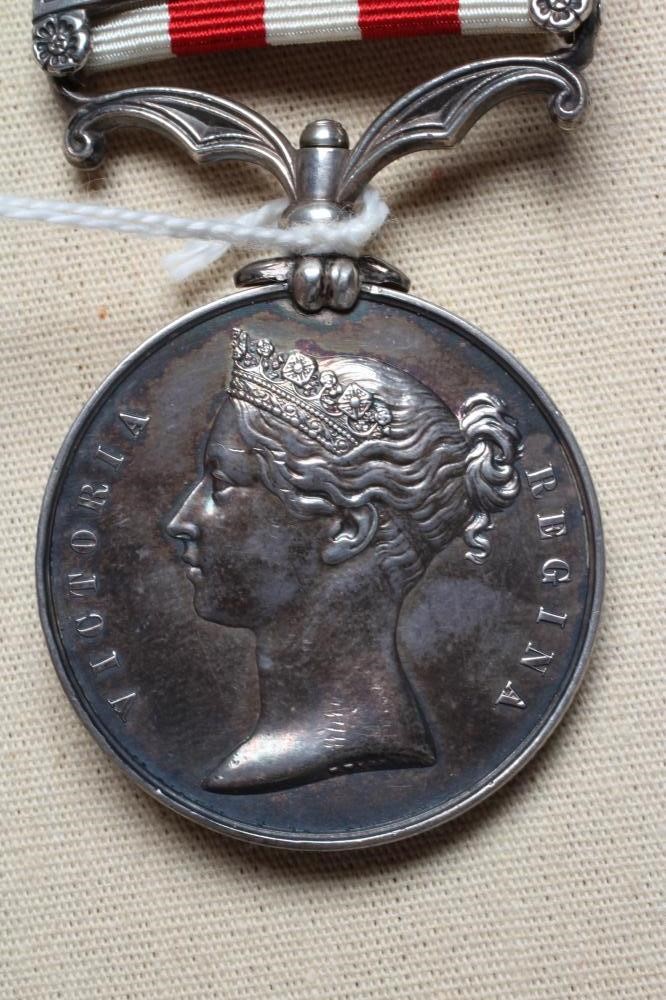 AN INDIAN MUTINY MEDAL with Delhi clasp, awarded to Robert Barrie of the 2nd European Bengal Image