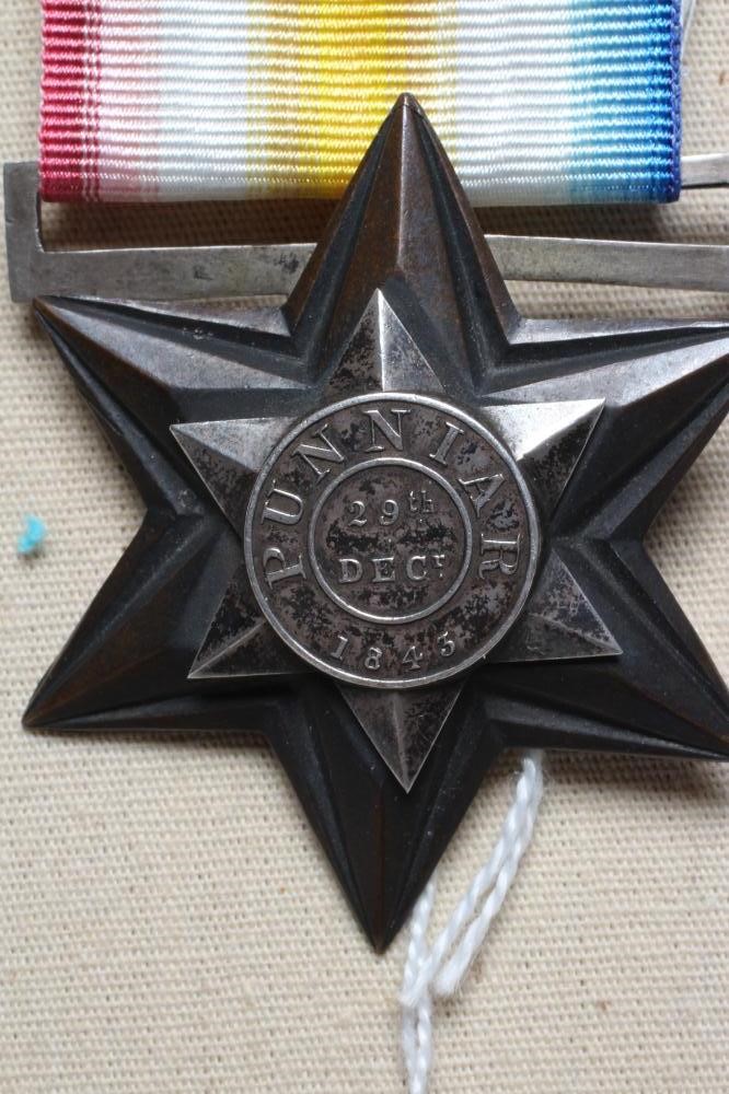 A GWALIOR STAR 1843 MEDAL, PUNNIAR awarded to Private Robert Henderson of the Queen's Royal Lancers Image
