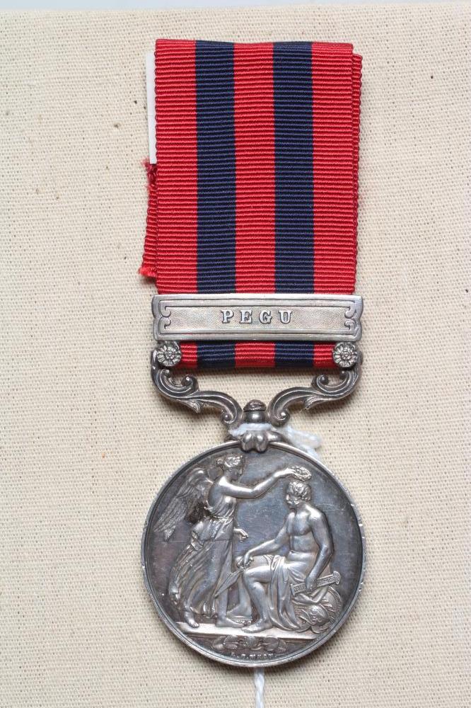 AN INDIAN GENERAL SERVICE MEDAL 1854 with Pegu clasp, awarded to John Sweeney of the 18th Royal Image