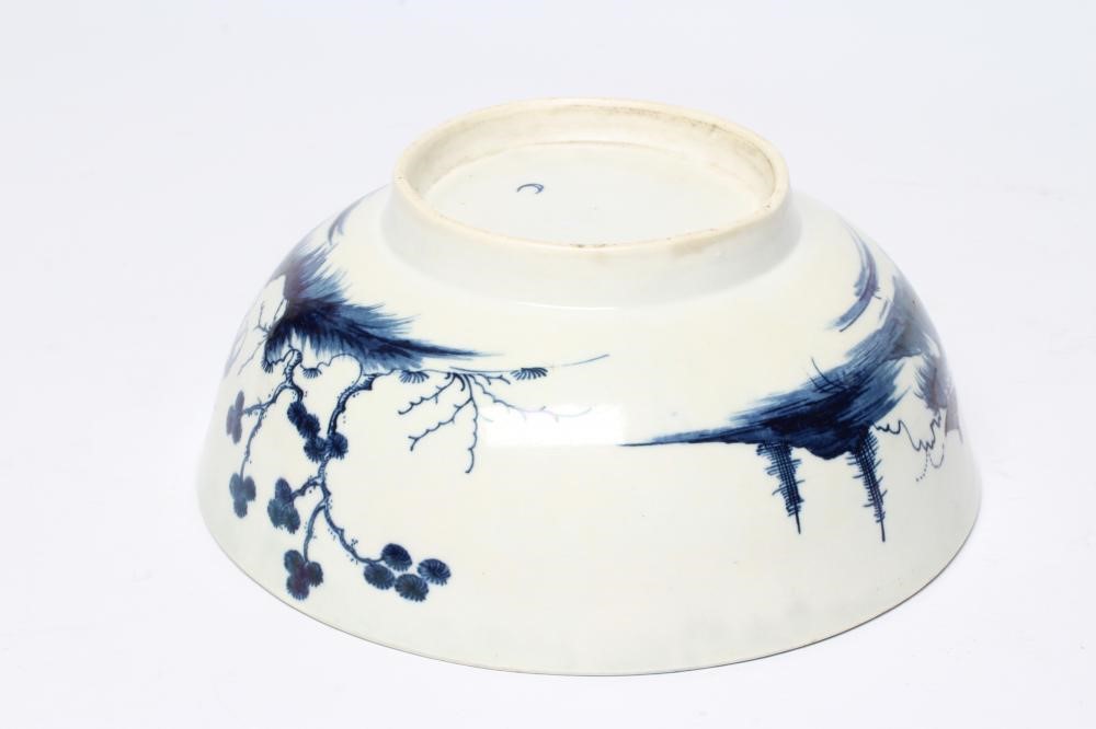 A WORCESTER PORCELAIN PRECIPICE PATTERN BOWL, c.1770, of plain circular form painted in underglaze Image