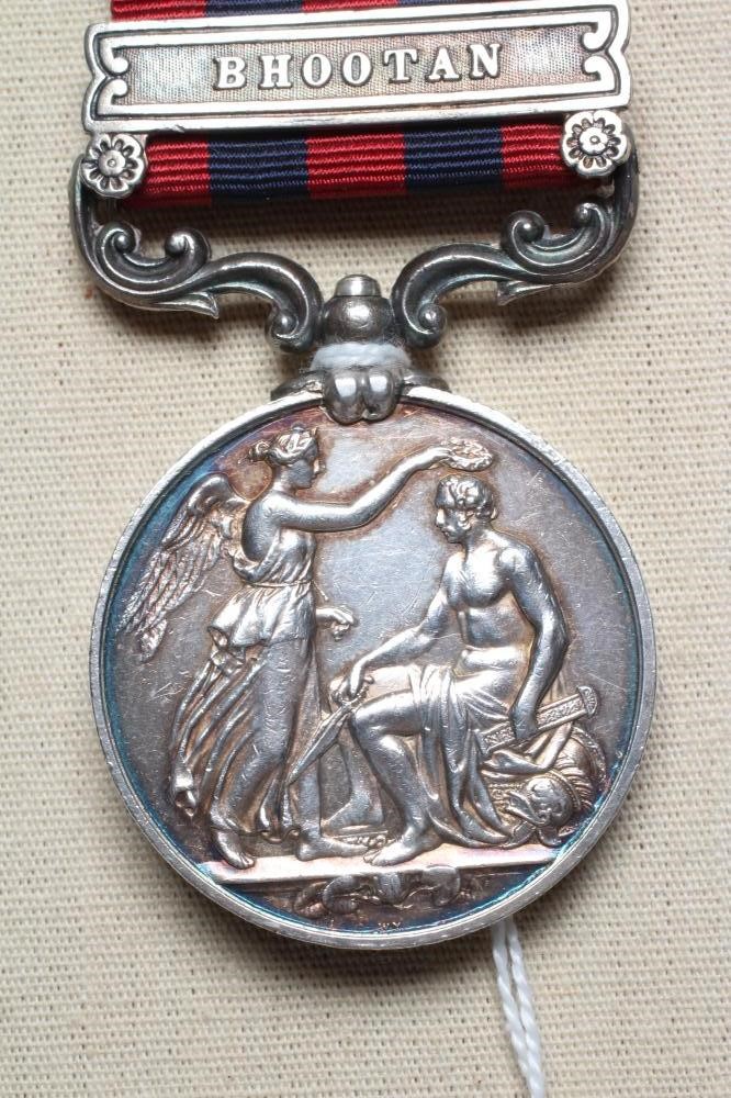 AN INDIAN GENERAL SERVICE MEDAL 1854 with Bhootan clasp, awarded to Thomas Tobin of H.M's 55th Image