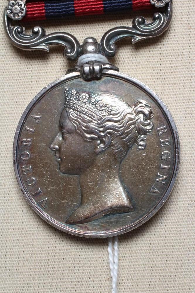 AN INDIAN GENERAL SERVICE MEDAL 1854 with Bhootan clasp, awarded to Thomas Tobin of H.M's 55th Image