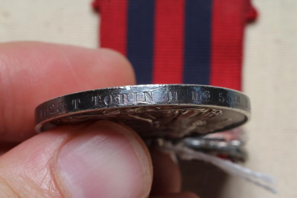 AN INDIAN GENERAL SERVICE MEDAL 1854 with Bhootan clasp, awarded to Thomas Tobin of H.M's 55th Image